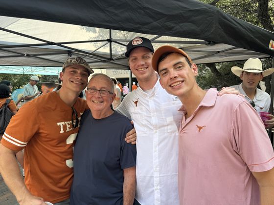 Four guests together under the tent.